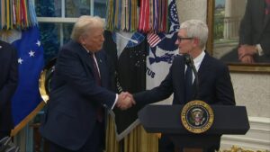 Apple CEO Tim Cook gifts President Trump gold & glass commemorative plaque