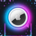 Apple AirTag centered against a dark background, surrounded by glowing blue and pink neon rings, with colorful triangular patterns scattered around like confetti.