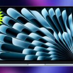 Open MacBook Air M5 laptop with abstract blue radial pattern on screen, neon purple background, and bright yellow starburst badge in upper left corner displaying the word NEW