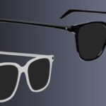 Two pairs of modern rectangular sunglasses, one black and one white, float against a dark gradient background, shown from a slight angle highlighting their thick frames and arms